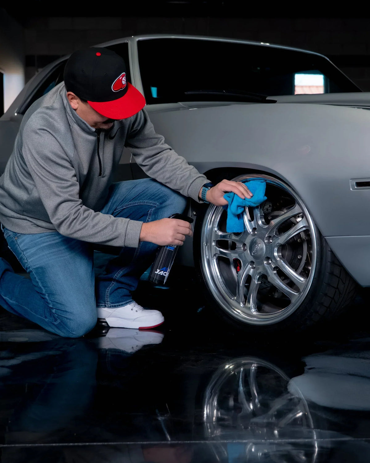 Man cleaning the wheels using the Willertime All Jack Car Detail Spray